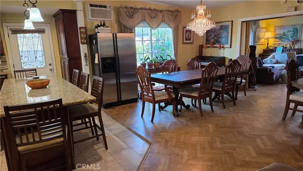 a view of a dining room with furniture window and outside view