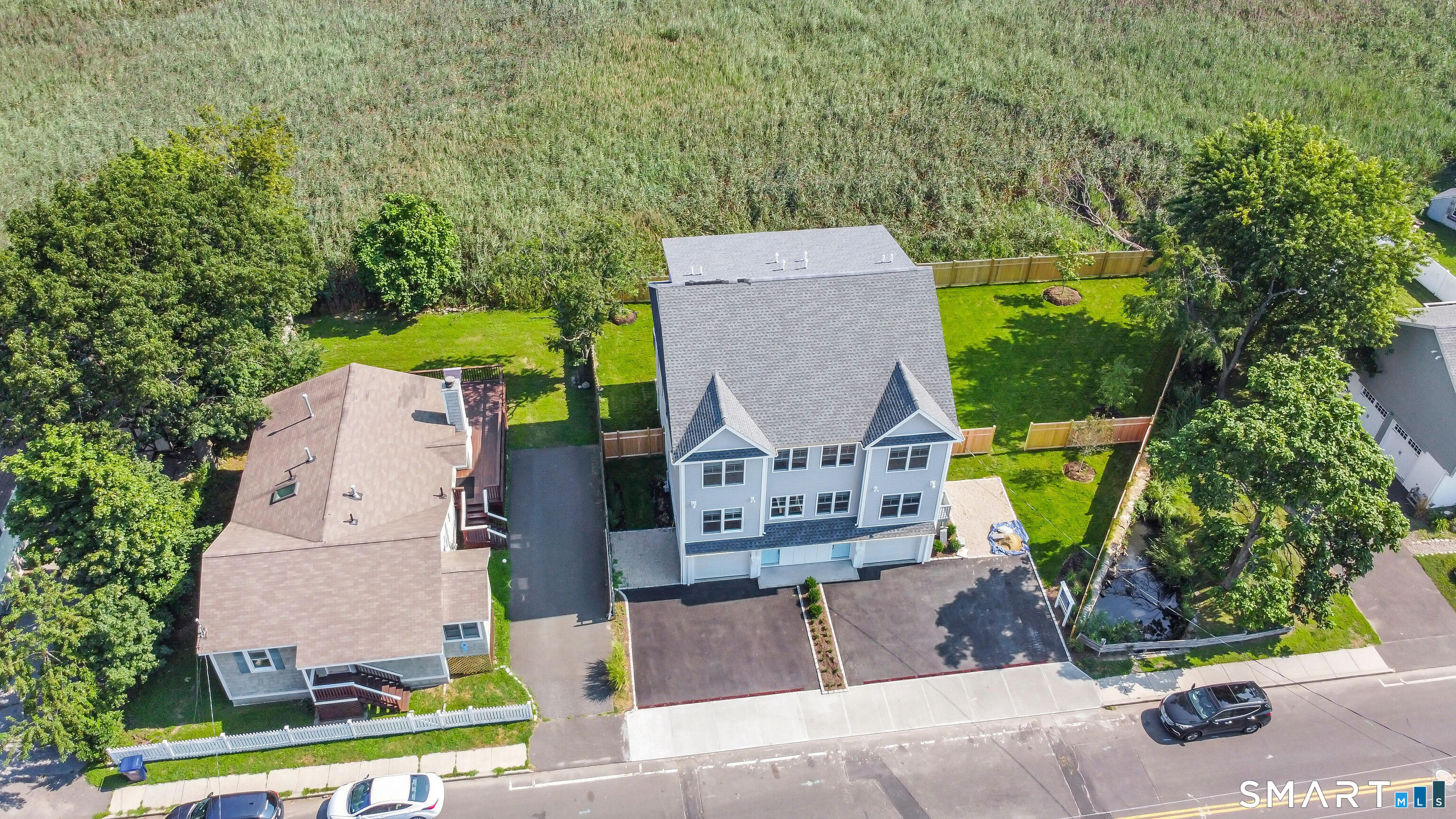 997 Reef Road Fairfield, CT 06824 - Photo 8 of 15 an aerial view of a house with garden space and street view
