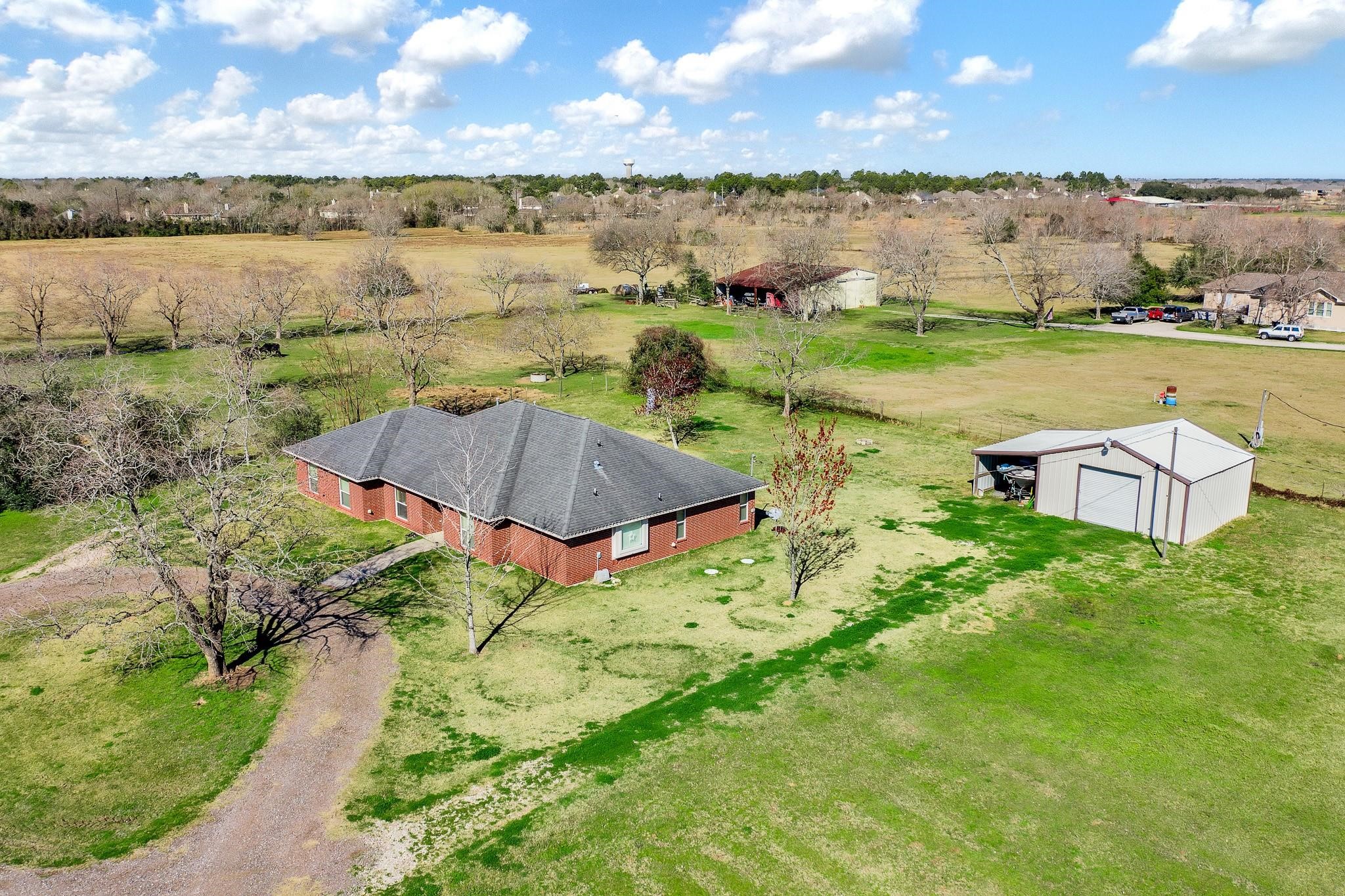 15815 Merle Road Cypress, TX 77433 - Photo 12 of 16 a view of a lake with a yard