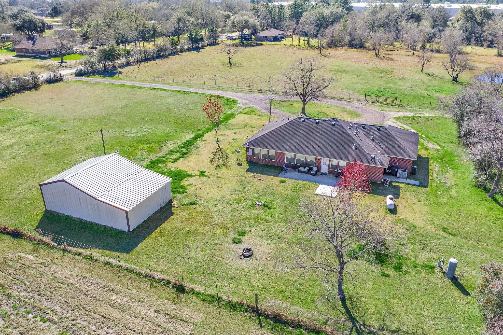15815 Merle Road Cypress, TX 77433 - Photo 13 of 16 an aerial view of a house with garden space and lake view