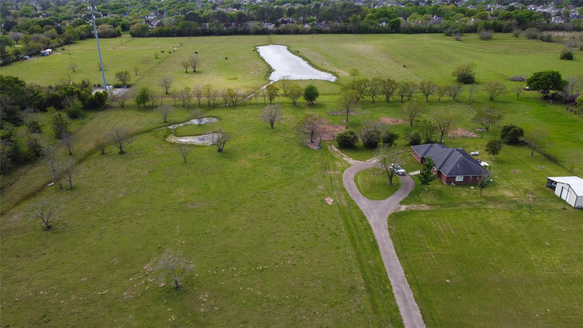15815 Merle Road Cypress, TX 77433 - Photo 14 of 16 a view of a lake with a yard
