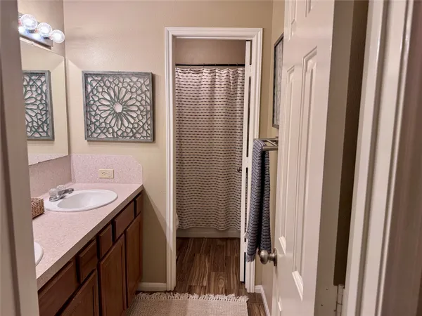 a bathroom with a sink and a mirror