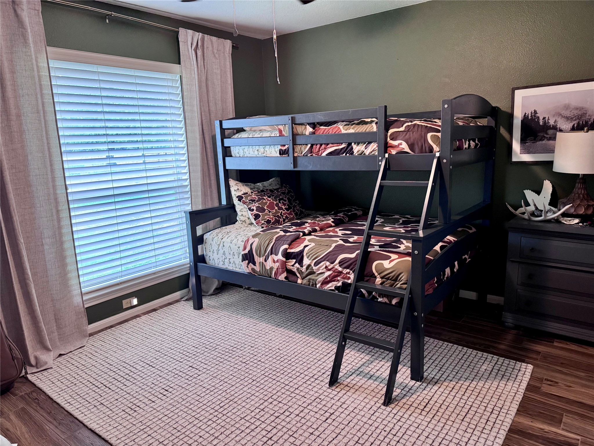 15815 Merle Road Cypress, TX 77433 - Photo 9 of 16 a bedroom with a bed and a table