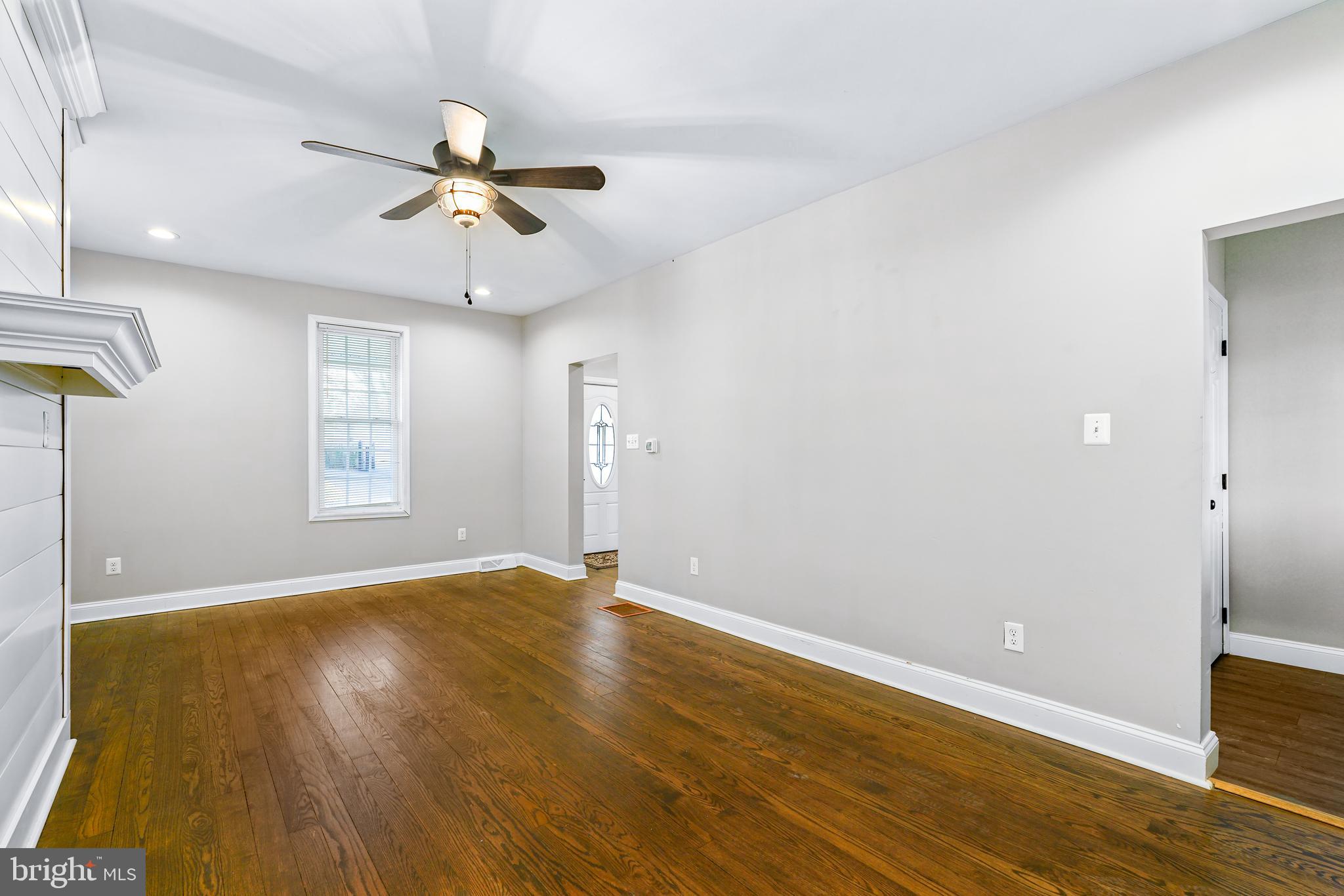 132 South Queen Street Rising Sun, MD 21911 - Photo 14 of 29 a view of an empty room with window and wooden floor