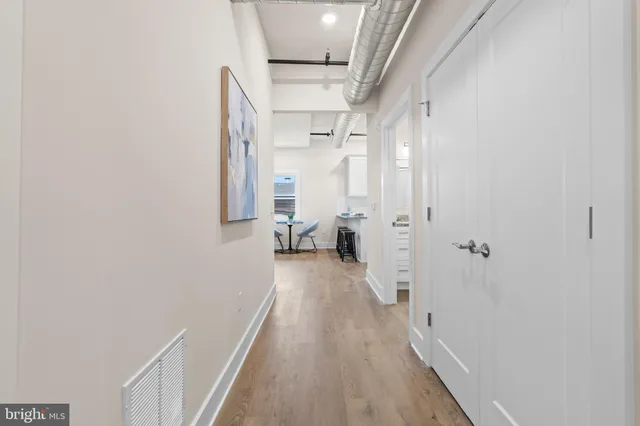 a view of living room with wooden floor