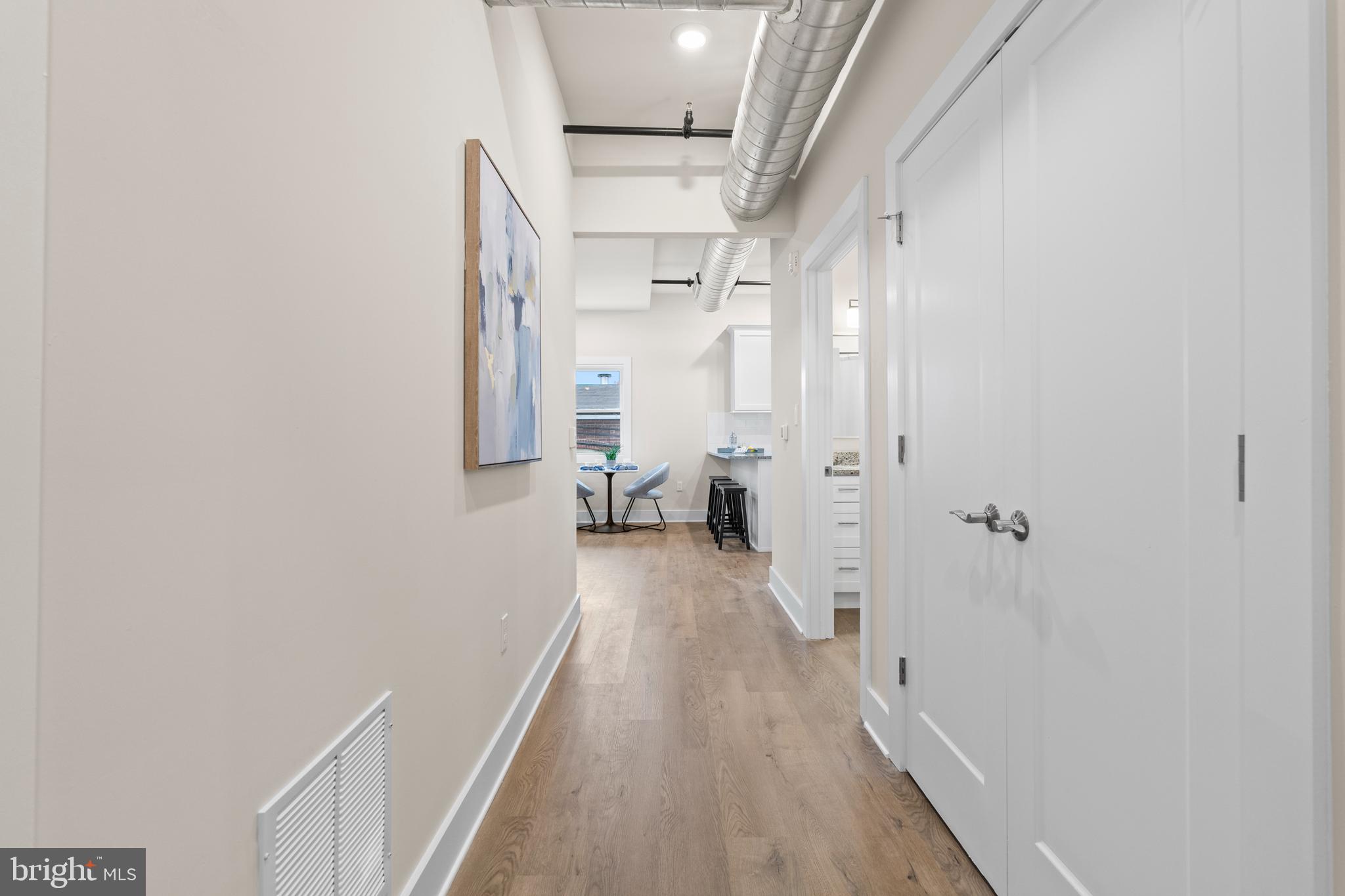 30 West Broad Street Souderton, PA 18964 - Photo 11 of 38 a view of a hallway with wooden floor and staircase