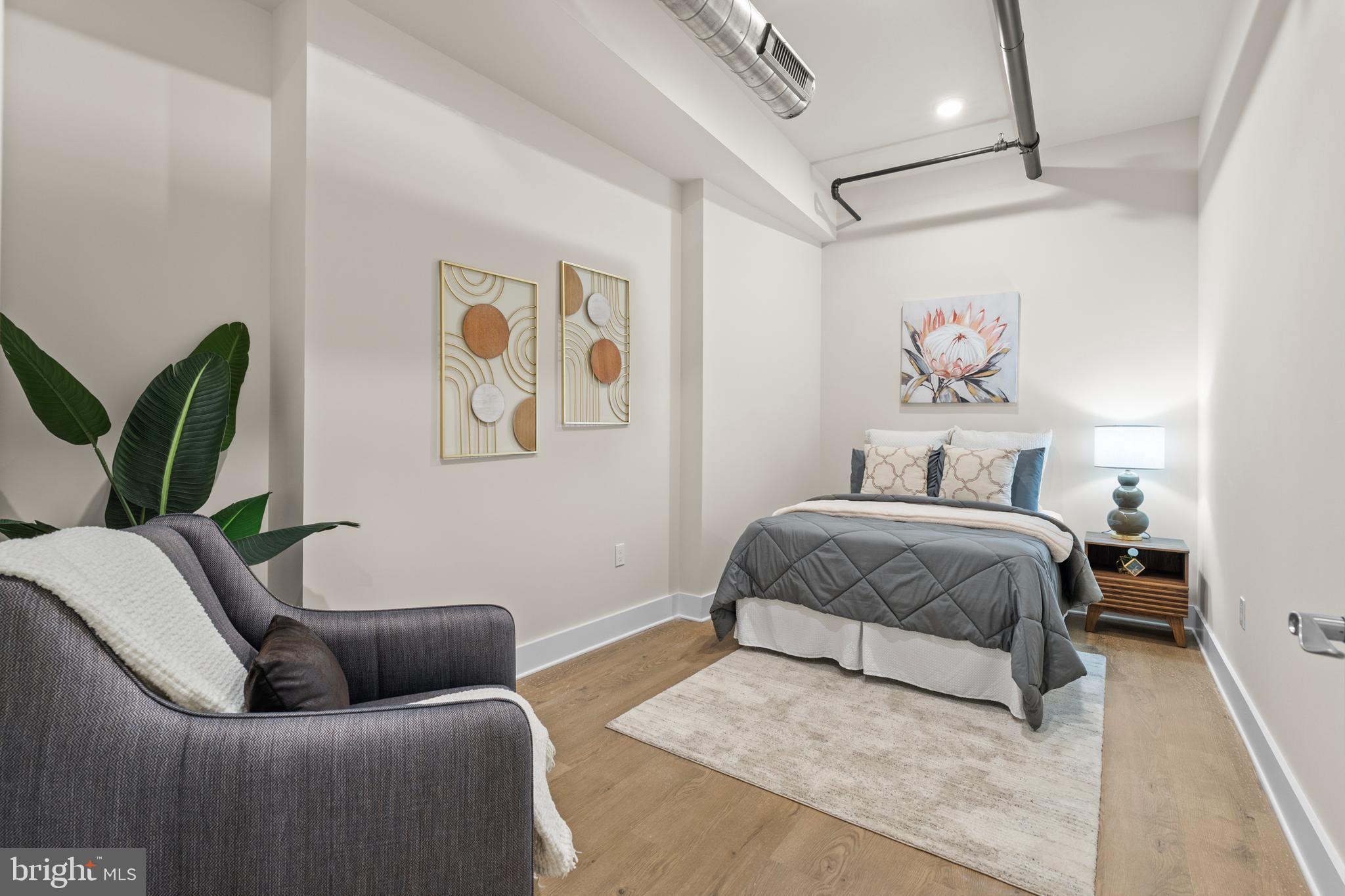 30 West Broad Street Souderton, PA 18964 - Photo 12 of 38 a bedroom with a bed couch and painting on the wall