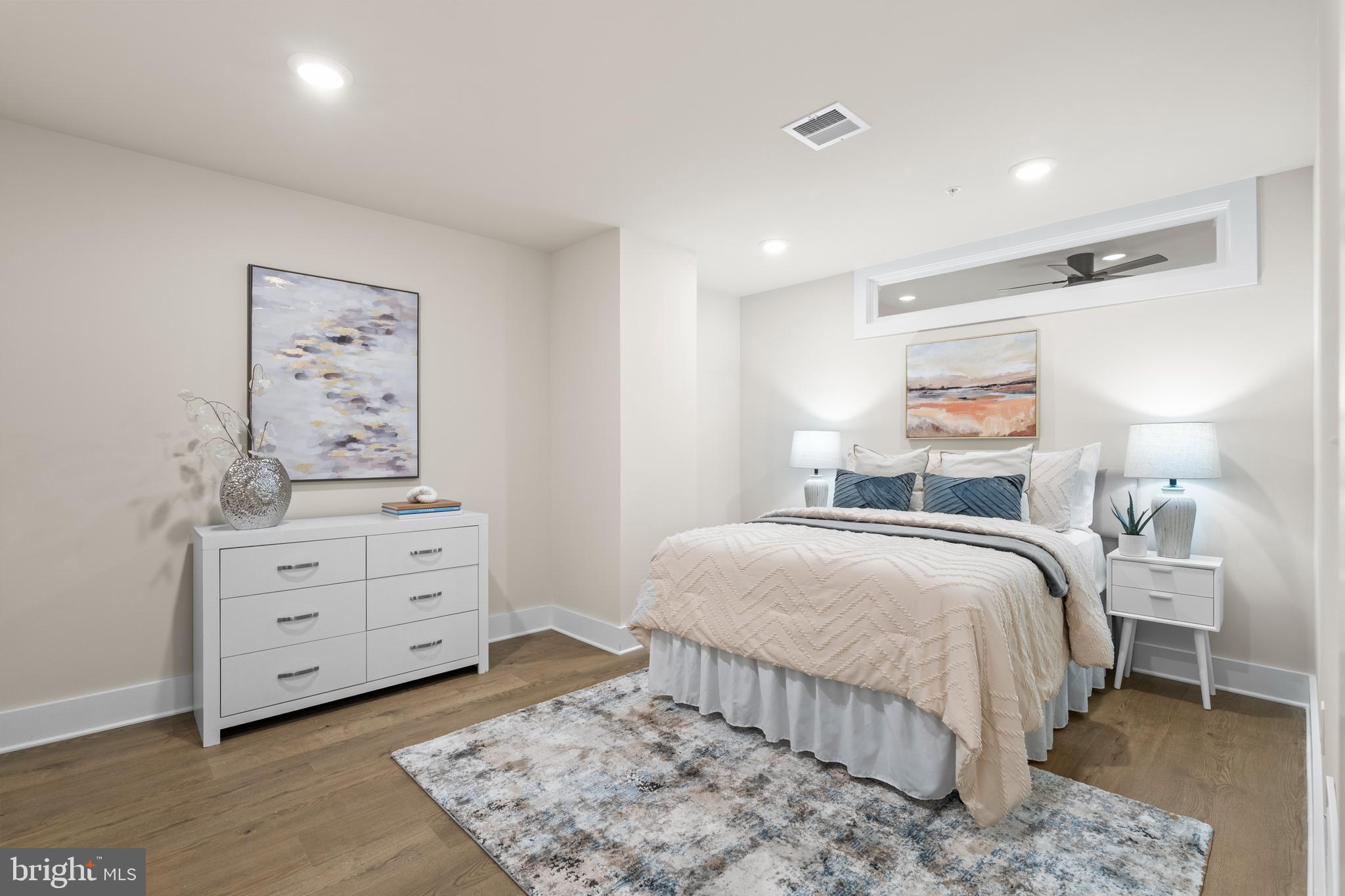 30 West Broad Street Souderton, PA 18964 - Photo 15 of 38 a bedroom with a bed and a night stand