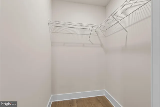 a bedroom with a bed and a walk in closet