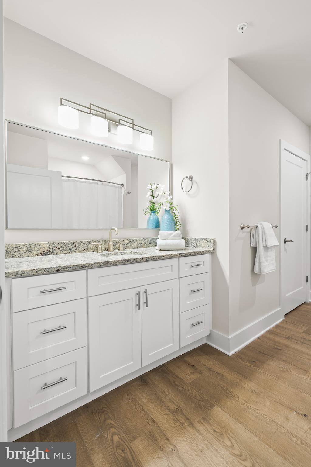 30 West Broad Street Souderton, PA 18964 - Photo 22 of 38 a spacious bathroom with a granite countertop sink and a mirror