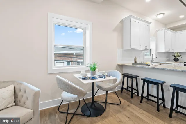 a kitchen with sink and cabinets