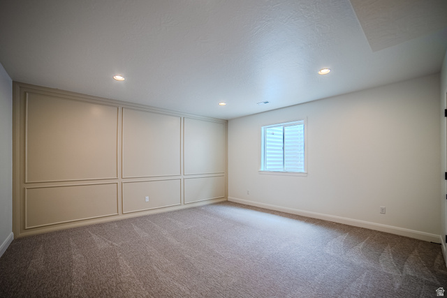 223 South Cottonwood Road, Unit 7501 Vineyard, UT 84059 - Photo 13 of 45 Accent wall featuring decorative panel molding and recessed lighting