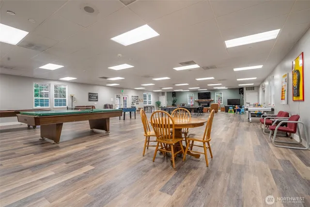 a kitchen with a table and chairs