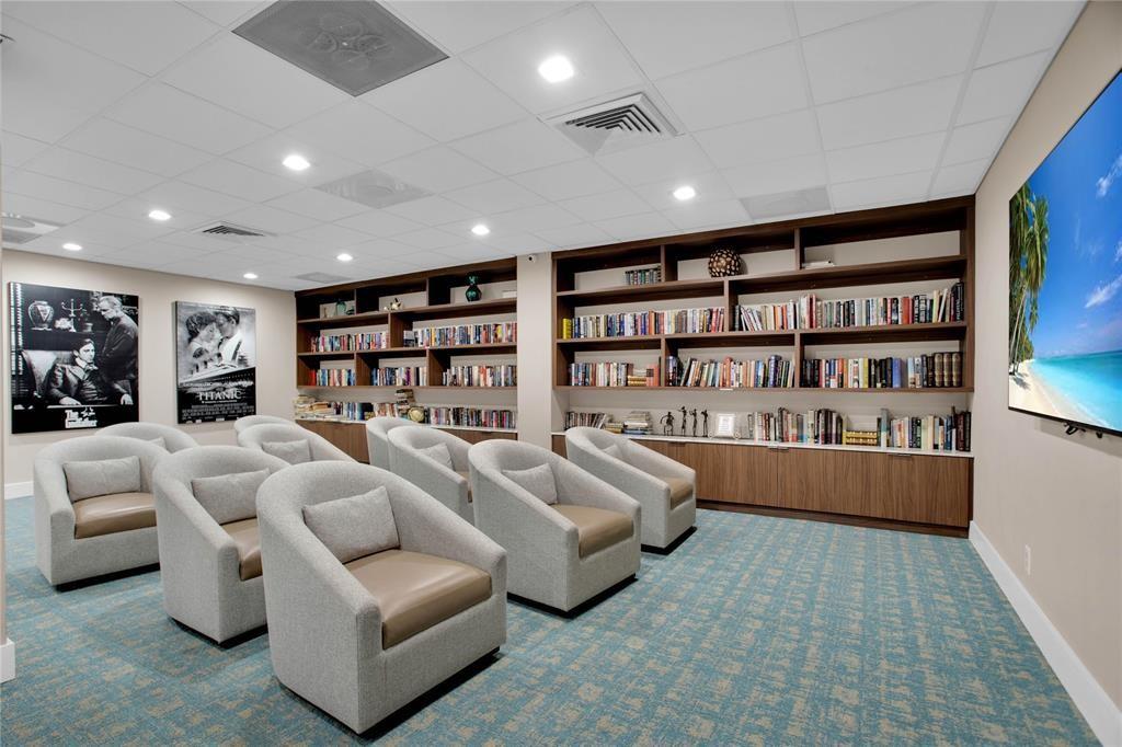 3500 Galt Ocean Drive, Unit 1408 Fort Lauderdale, FL 33308 - Photo 23 of 24 a living room with furniture and a book shelf