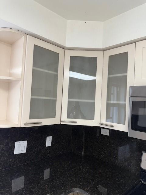 3500 Galt Ocean Drive, Unit 1408 Fort Lauderdale, FL 33308 - Photo 8 of 24 a view of an empty room with wooden floor and a window