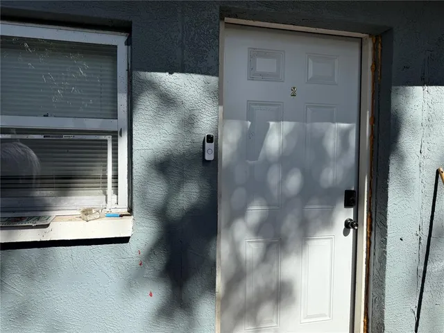 a kitchen with granite countertop a sink and stainless steel appliances