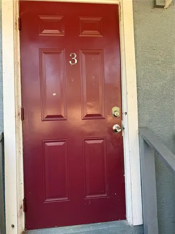 a kitchen with a stove and cabinets
