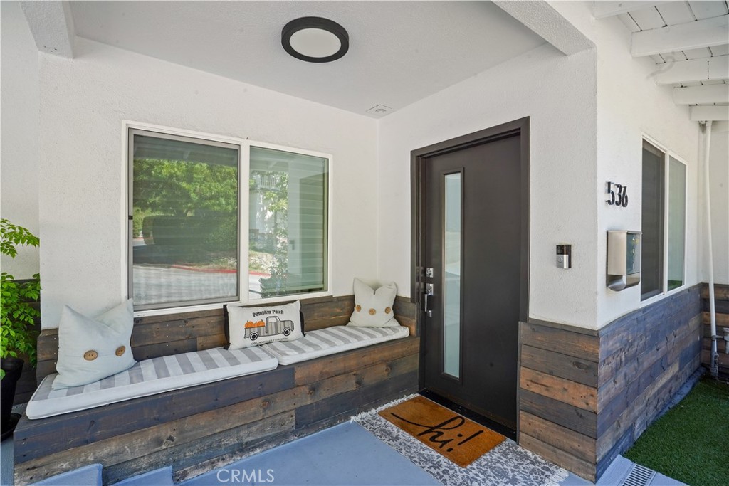 536 Cavanagh Road Glendale, CA 91207 - Photo 2 of 39 a bathroom with a tub a sink and a large mirror next to a window