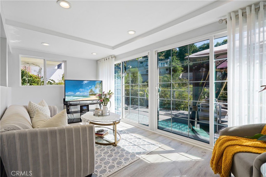 536 Cavanagh Road Glendale, CA 91207 - Photo 21 of 39 a living room with furniture and a floor to ceiling window