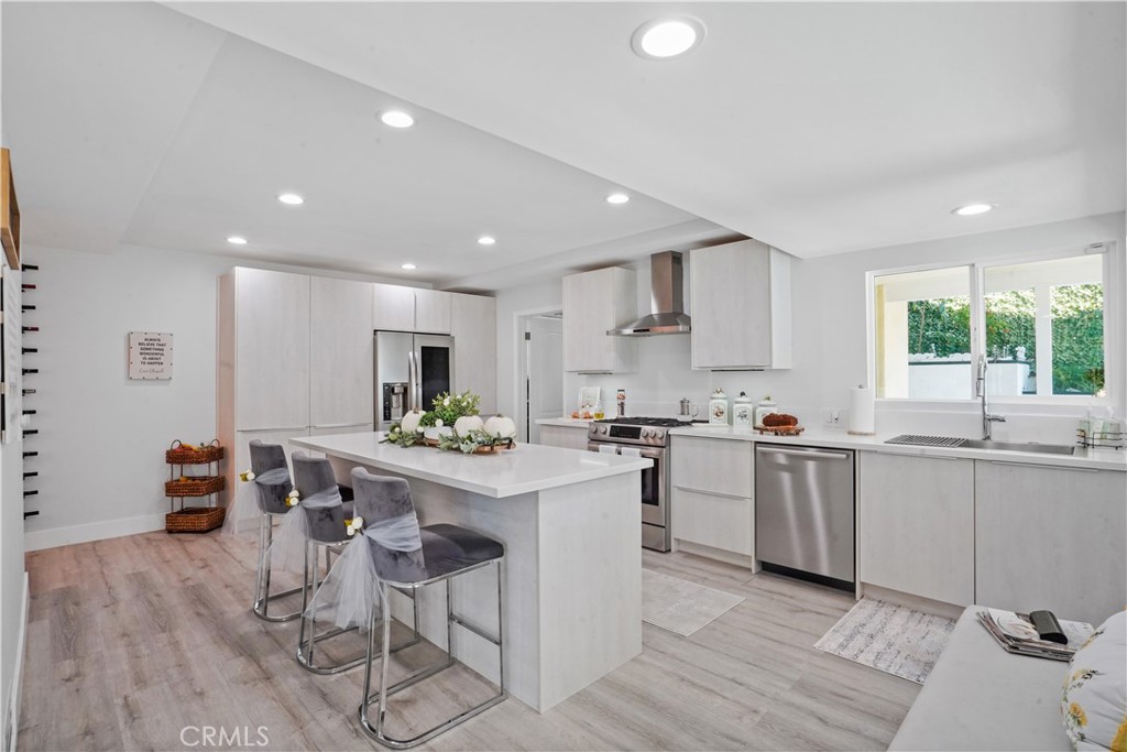 536 Cavanagh Road Glendale, CA 91207 - Photo 23 of 39 a kitchen with stainless steel appliances a table and chairs in it