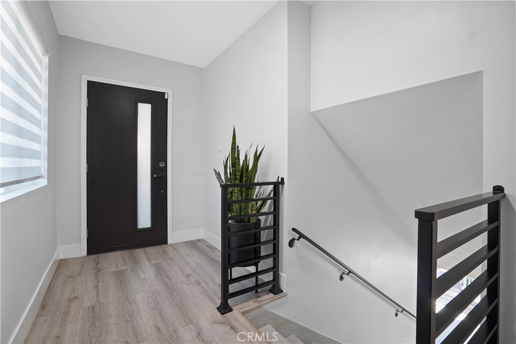 536 Cavanagh Road Glendale, CA 91207 - Photo 3 of 39 a view of a hallway with wooden floor and stairs