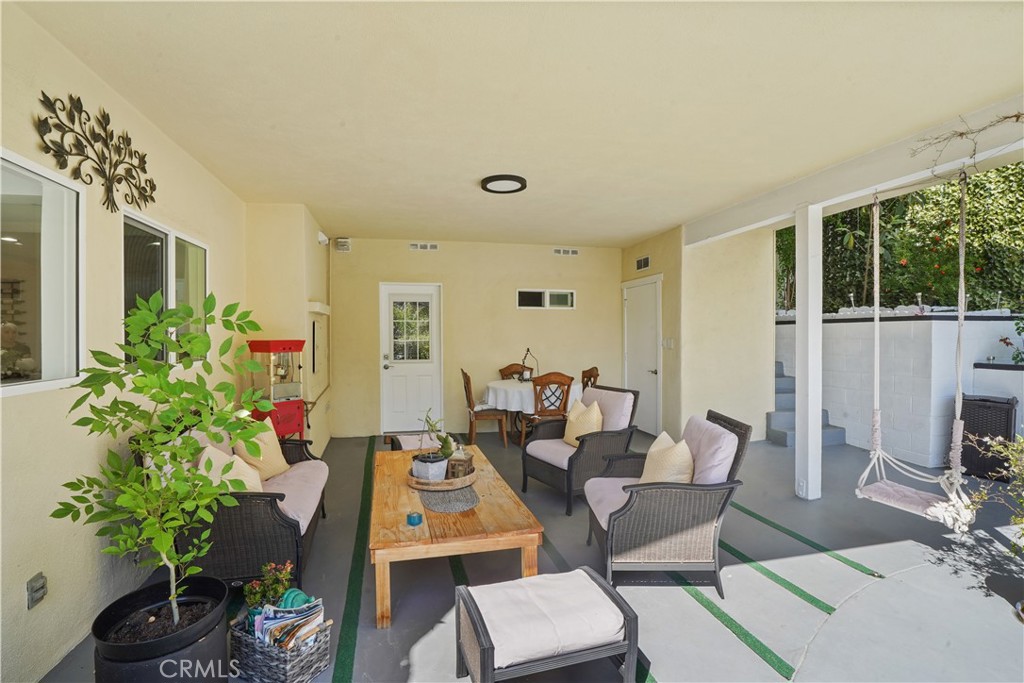 536 Cavanagh Road Glendale, CA 91207 - Photo 33 of 39 a living room with furniture potted plant and a large window