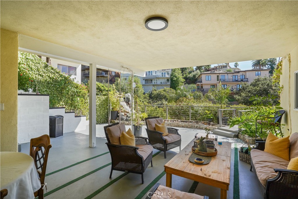 536 Cavanagh Road Glendale, CA 91207 - Photo 34 of 39 a view of a patio with couches table and chairs and potted plants