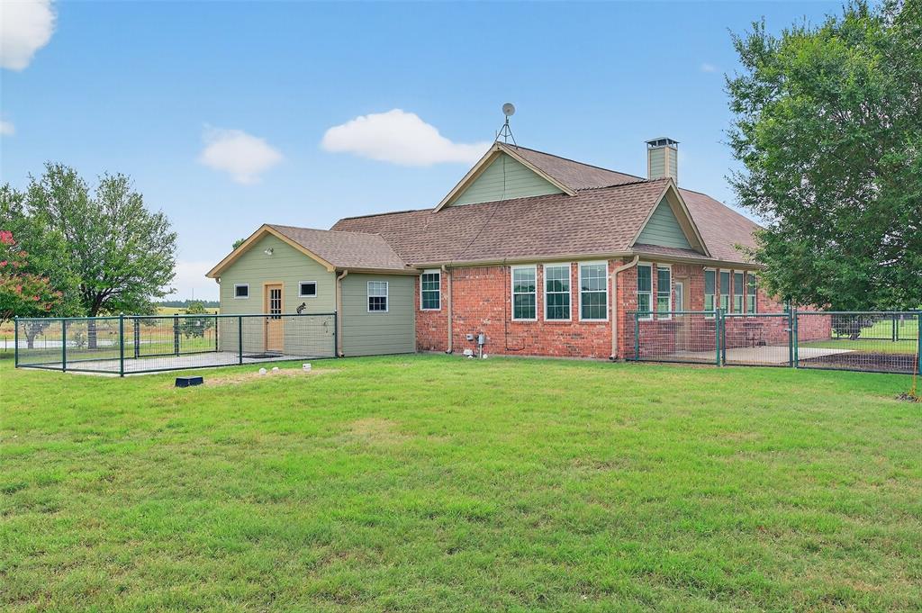 551 Massey Road Gunter, TX 75058 - Photo 17 of 40 a front view of a house with a garden