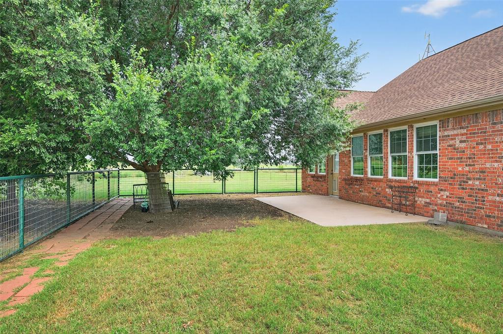 551 Massey Road Gunter, TX 75058 - Photo 18 of 40 a view of a yard with a house and tree