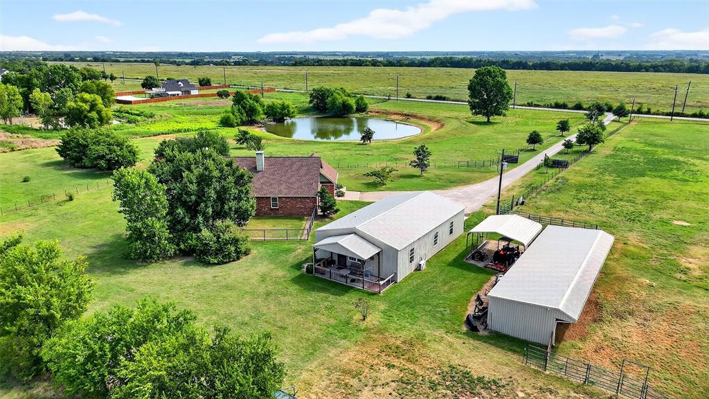 551 Massey Road Gunter, TX 75058 - Photo 2 of 40 an aerial view of a house with garden