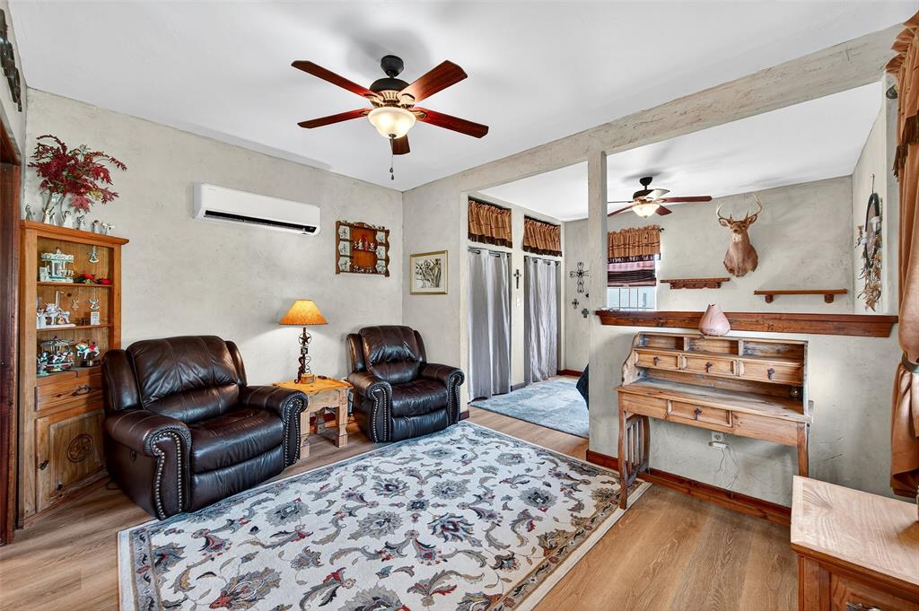 551 Massey Road Gunter, TX 75058 - Photo 22 of 40 a living room with furniture and wooden floor