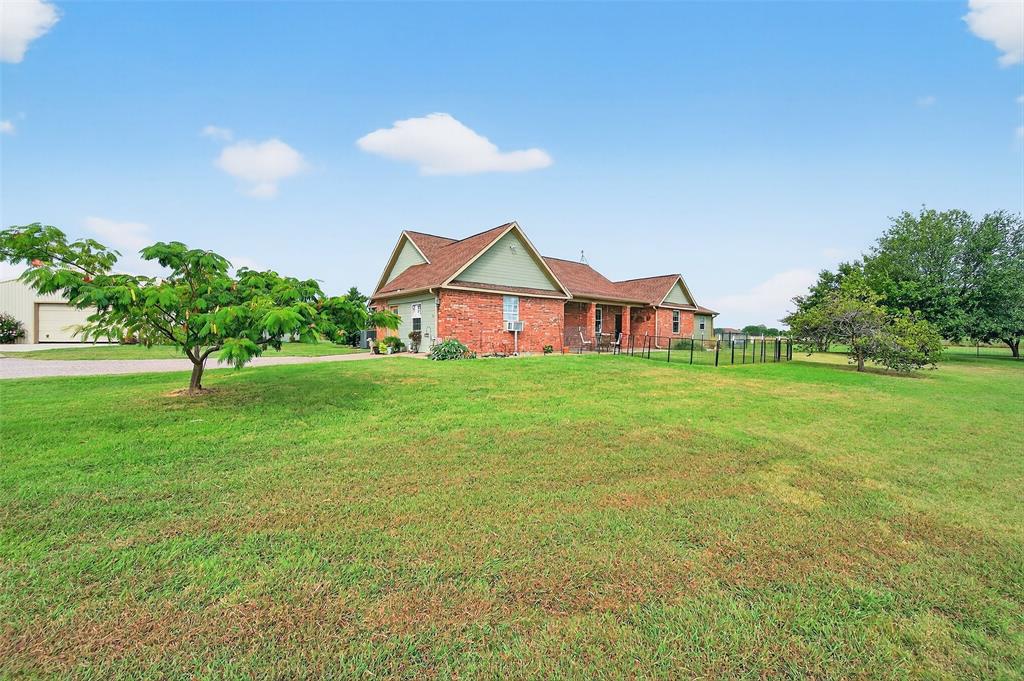 551 Massey Road Gunter, TX 75058 - Photo 3 of 40 a front view of house with yard and green space