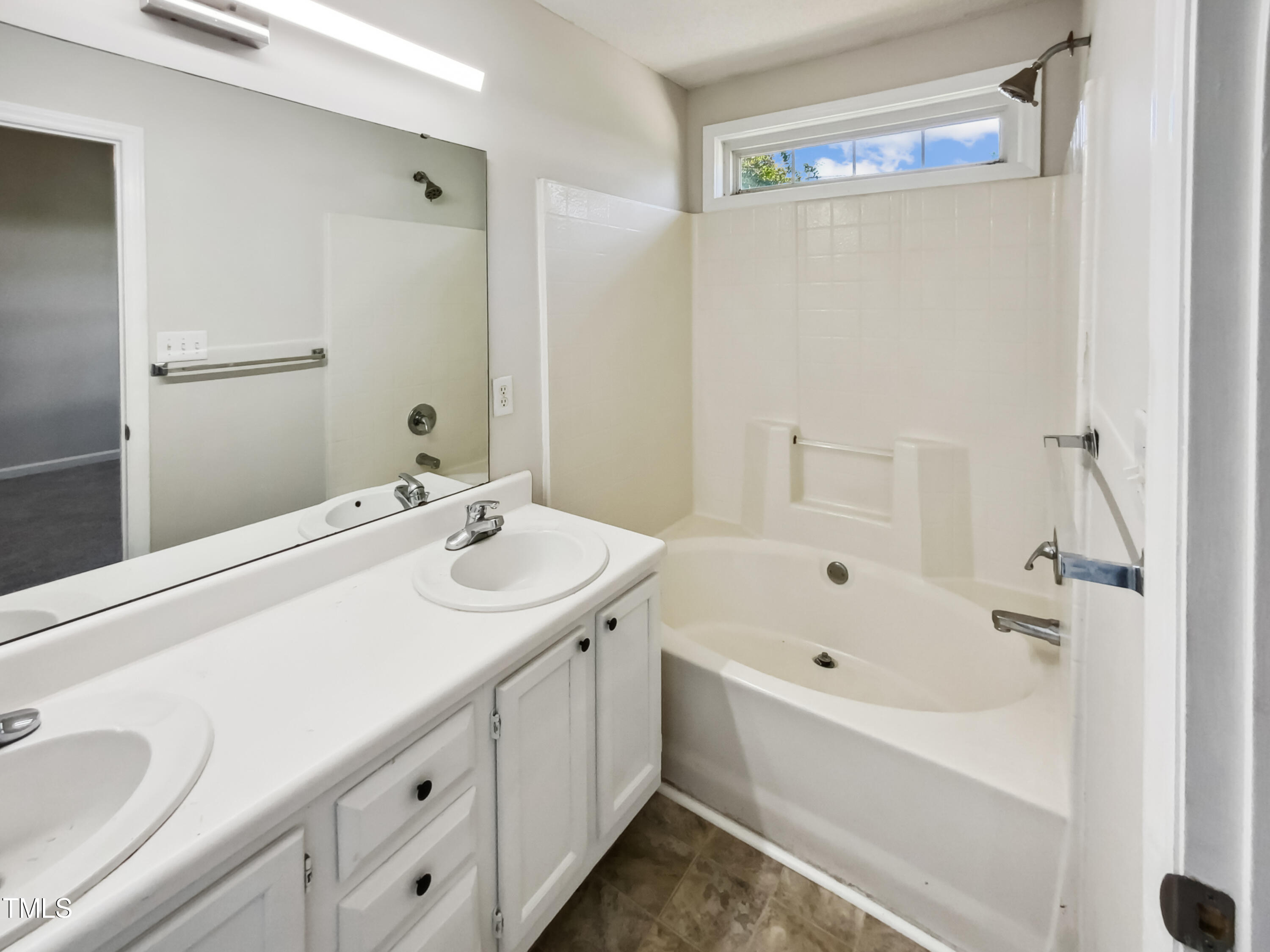 2221 Lockwood Folly Lane Raleigh, NC 27610 - Photo 12 of 19 a bathroom with a tub sink and mirror