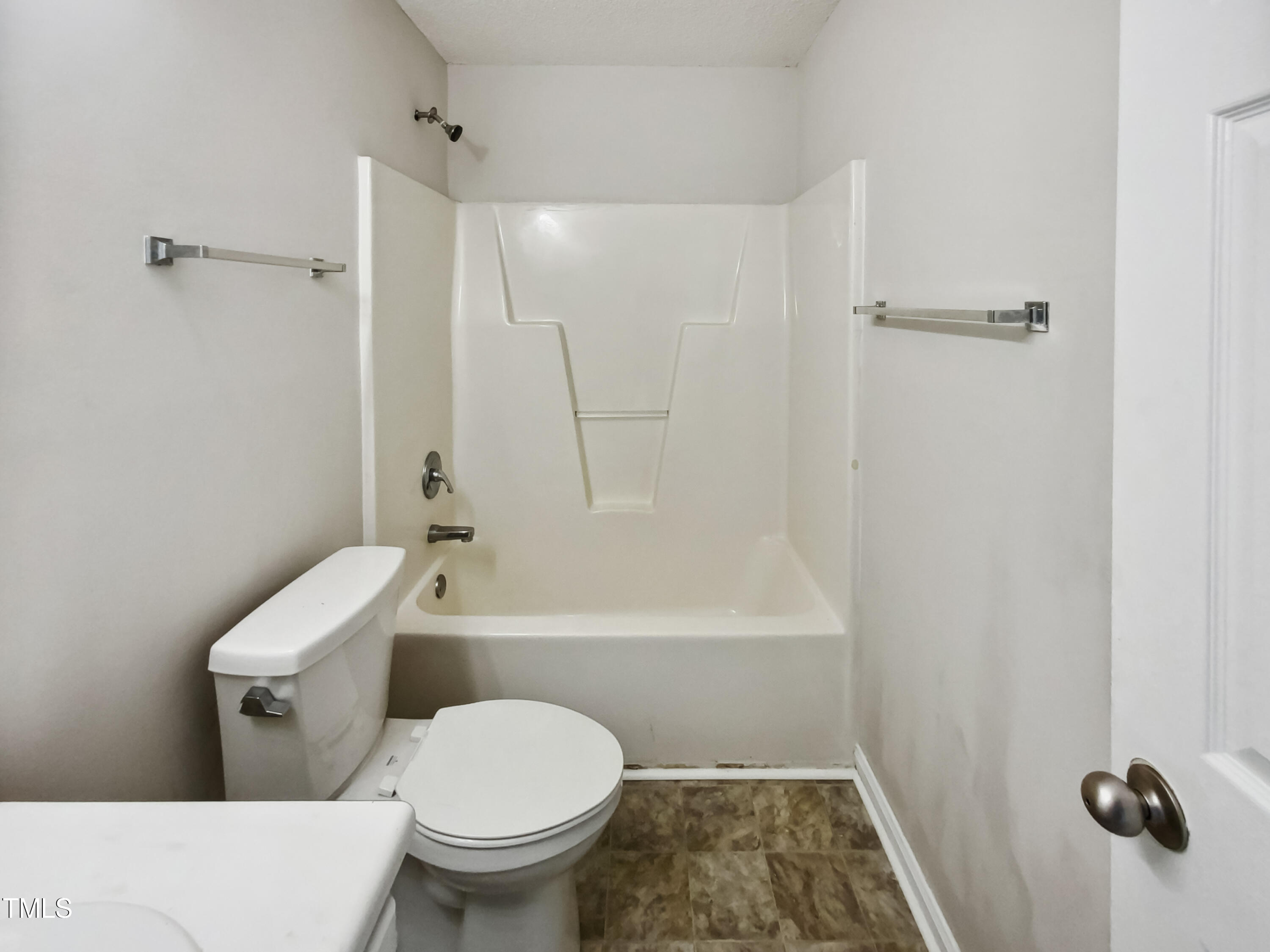 2221 Lockwood Folly Lane Raleigh, NC 27610 - Photo 15 of 19 a bathroom with a toilet and a shower