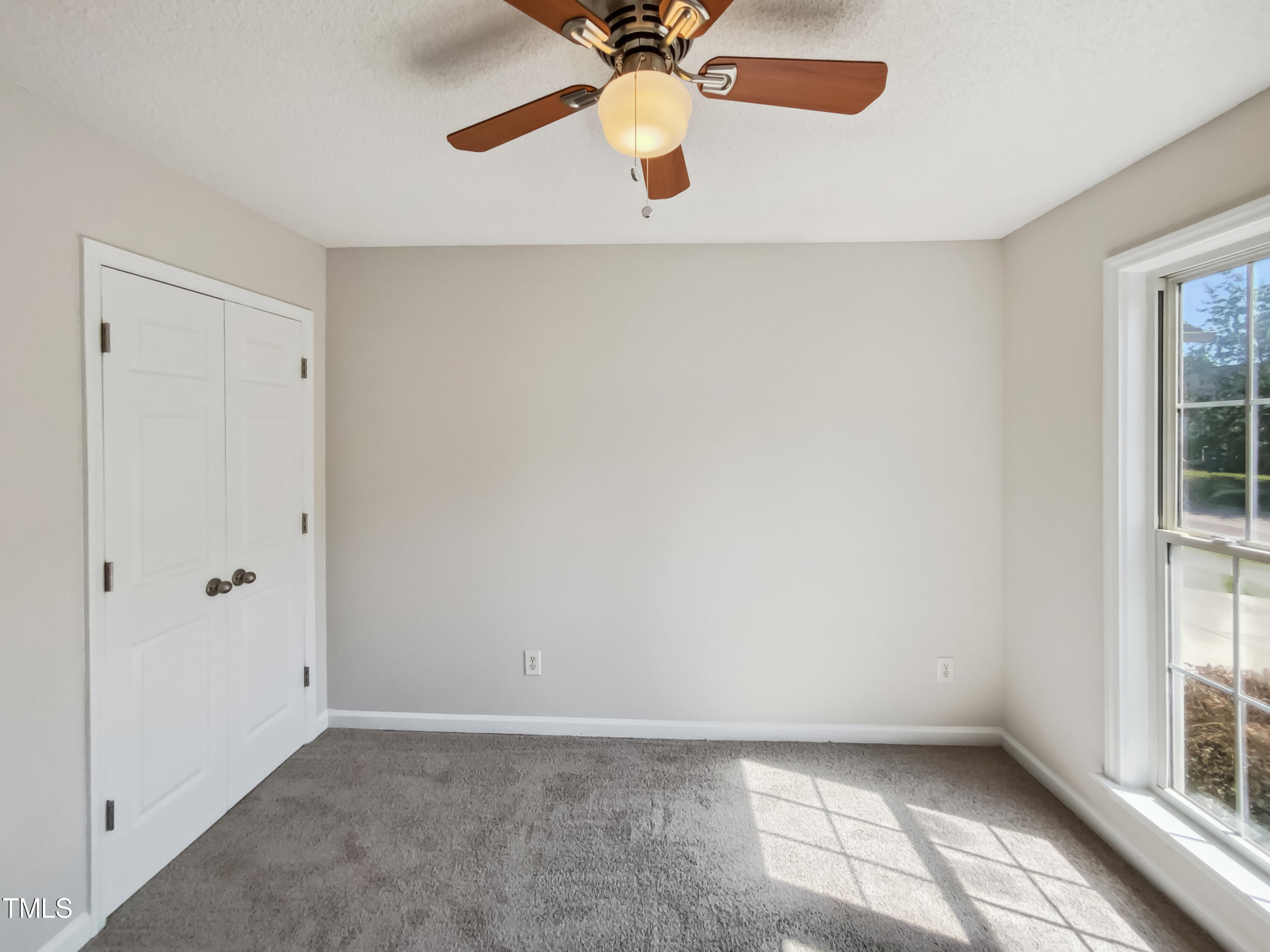 2221 Lockwood Folly Lane Raleigh, NC 27610 - Photo 16 of 19 a view of an empty room with a window
