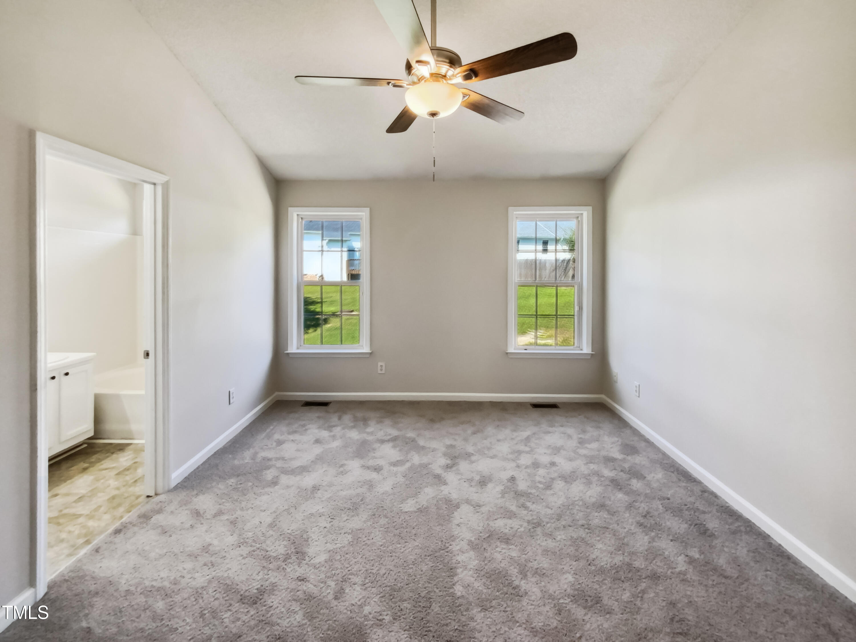 2221 Lockwood Folly Lane Raleigh, NC 27610 - Photo 5 of 19 a view of an empty room with a window