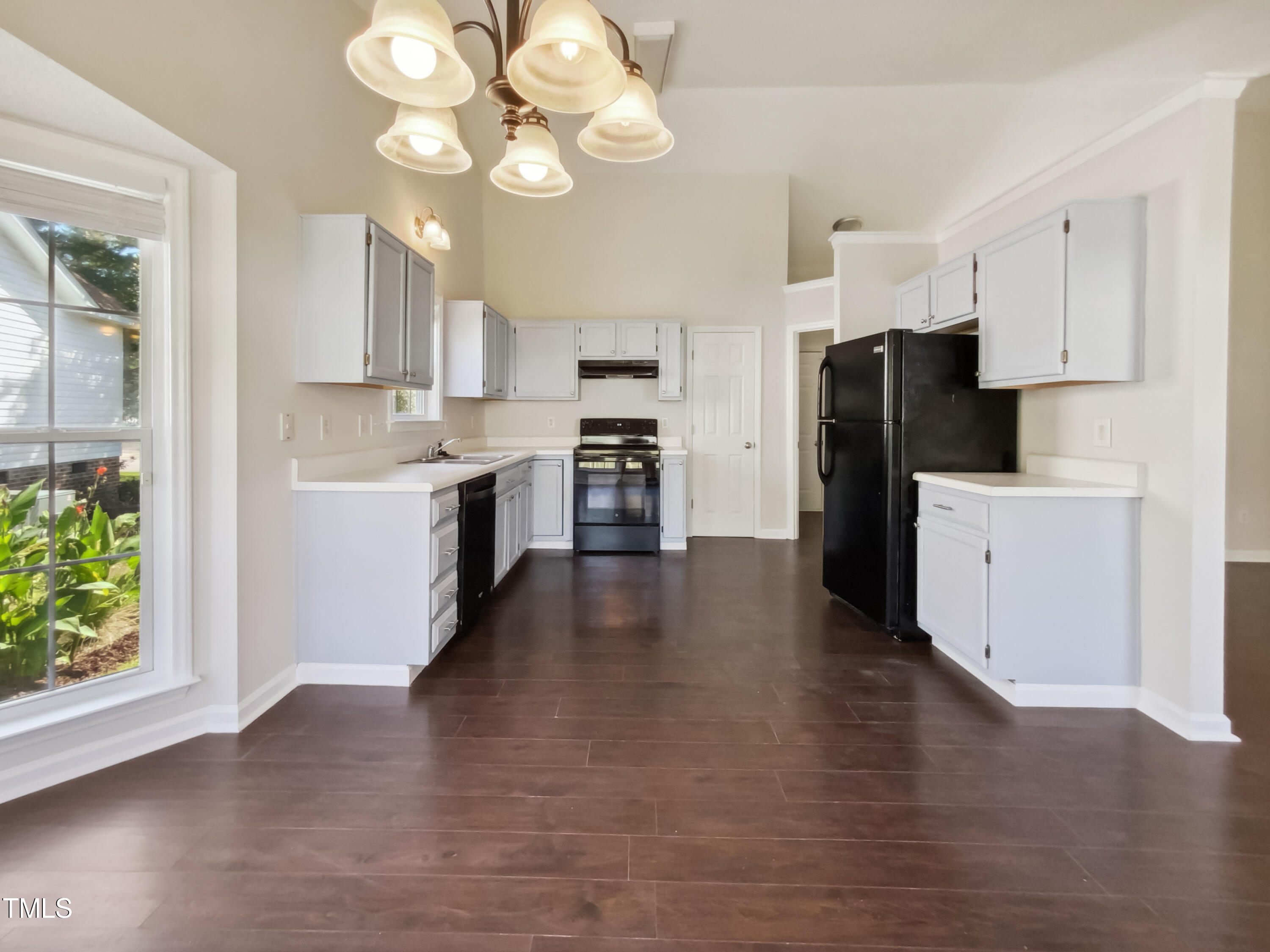 2221 Lockwood Folly Lane Raleigh, NC 27610 - Photo 6 of 19 a kitchen with stainless steel appliances granite countertop a refrigerator a stove top oven a sink dishwasher and a refrigerator with wooden floor