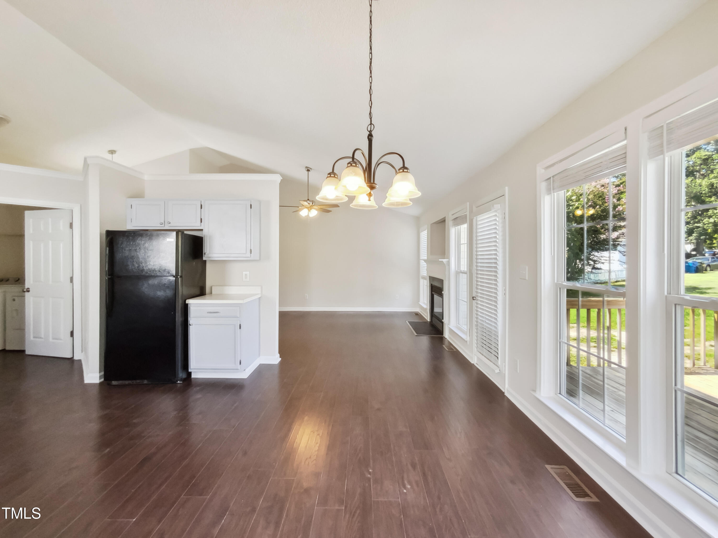 2221 Lockwood Folly Lane Raleigh, NC 27610 - Photo 9 of 19 a view of a kitchen with wooden floor and a large window