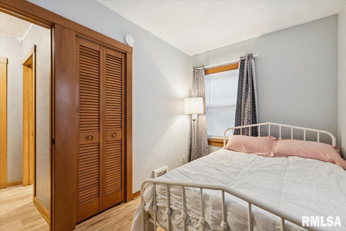 1820 33rd Street Moline, IL 61265 - Photo 11 of 25 a bedroom with a bed and a window