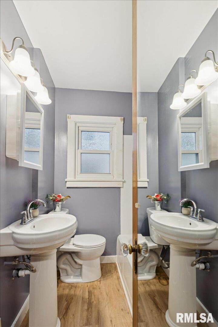 1820 33rd Street Moline, IL 61265 - Photo 13 of 25 a bathroom with a sink and a mirror