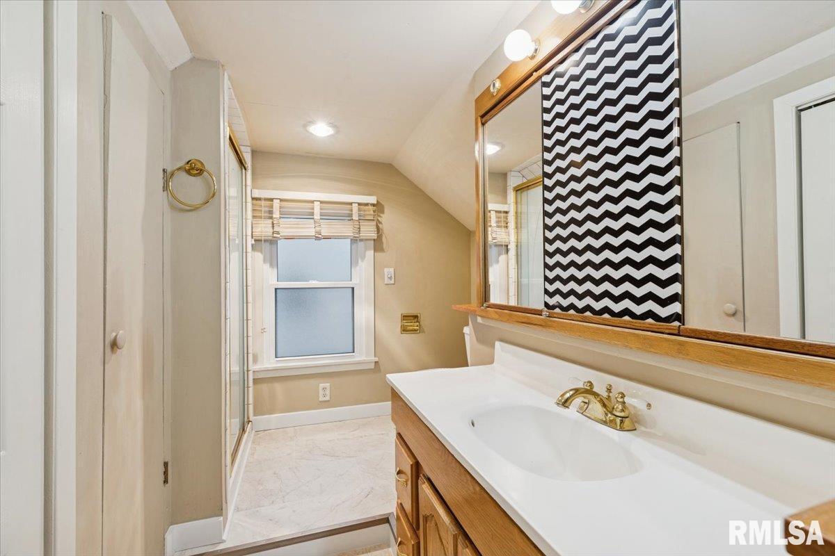 1820 33rd Street Moline, IL 61265 - Photo 18 of 25 a bathroom with a sink and a mirror