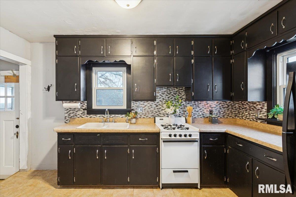 1820 33rd Street Moline, IL 61265 - Photo 6 of 25 a bathroom with a sink and a mirror