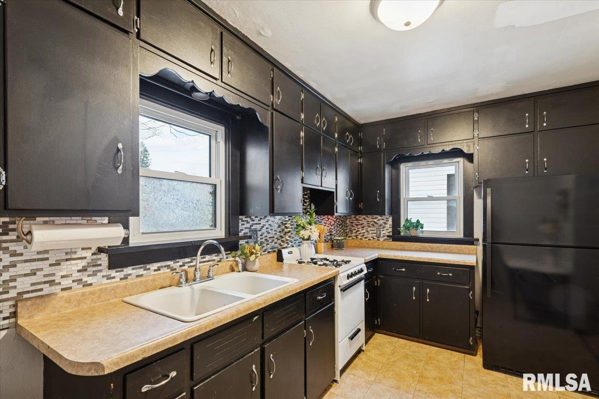 1820 33rd Street Moline, IL 61265 - Photo 7 of 25 a bathroom with a sink and a mirror