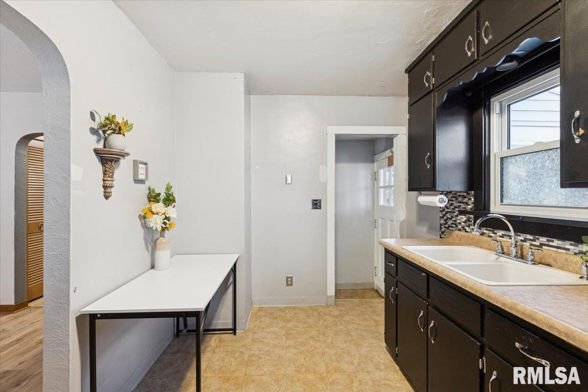 1820 33rd Street Moline, IL 61265 - Photo 8 of 25 a bathroom with a sink a toilet and mirror