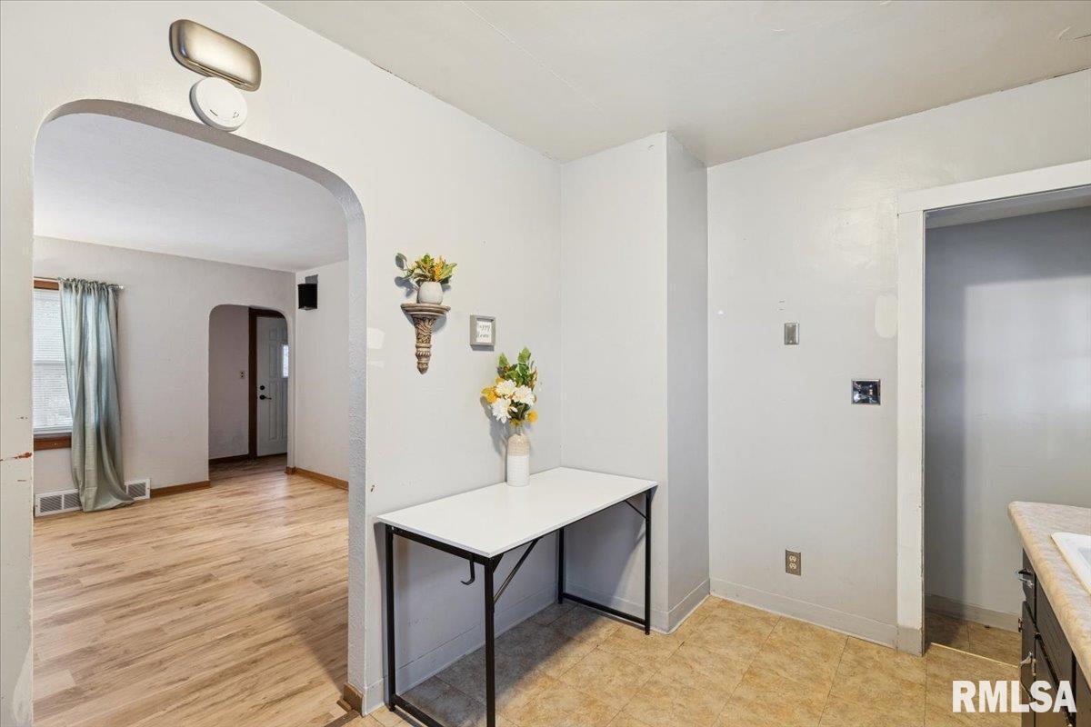 1820 33rd Street Moline, IL 61265 - Photo 9 of 25 a view of a hallway view with wooden floor and staircase