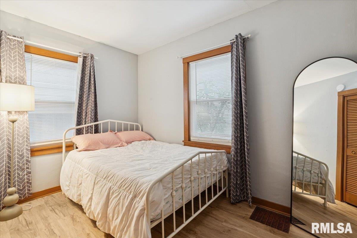 1820 33rd Street Moline, IL 61265 - Photo 10 of 25 a bedroom with a bed and a window