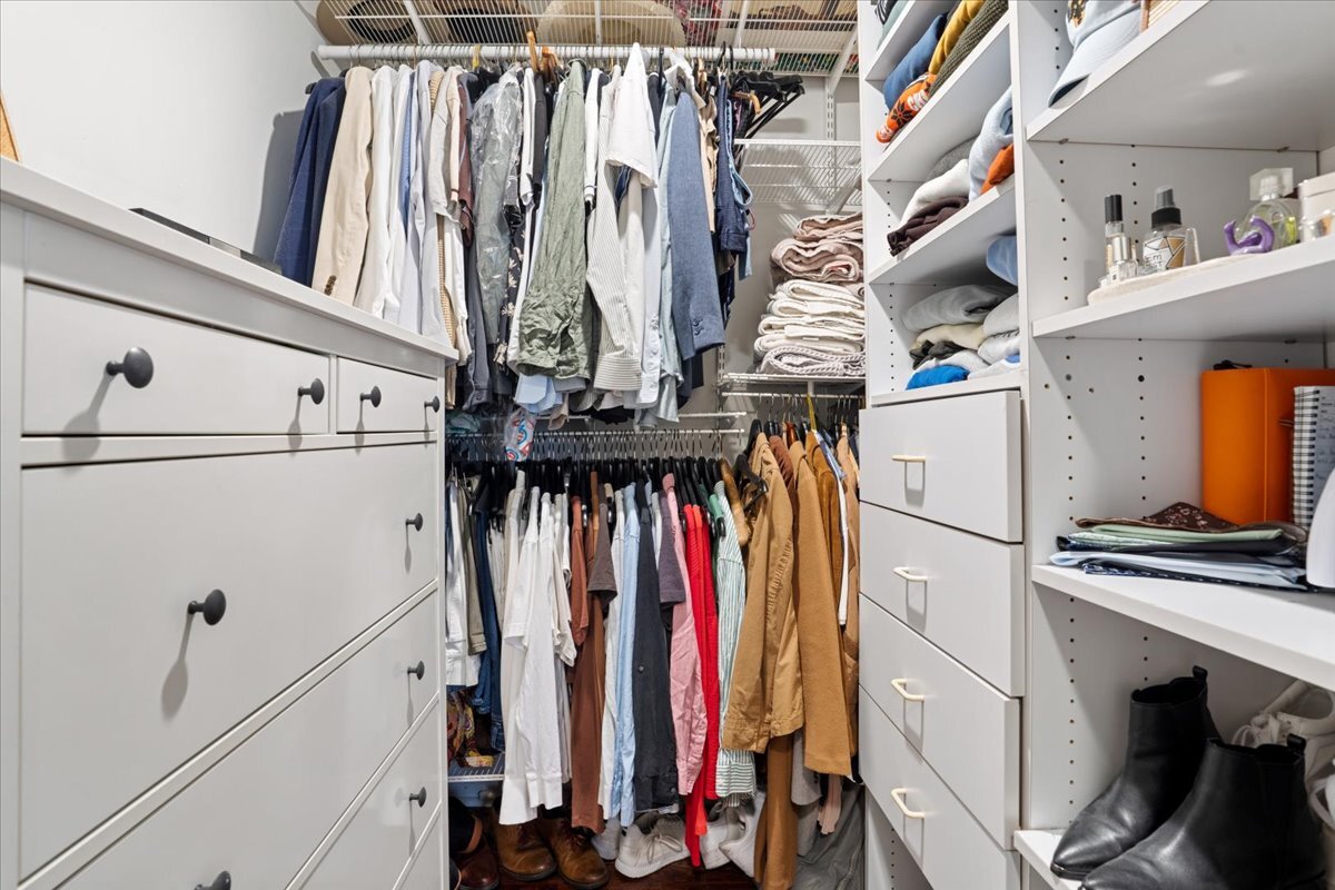 Undisclosed Address Chicago, IL 60613 - Photo 13 of 19 a view of walk in closet with clothes and shoes