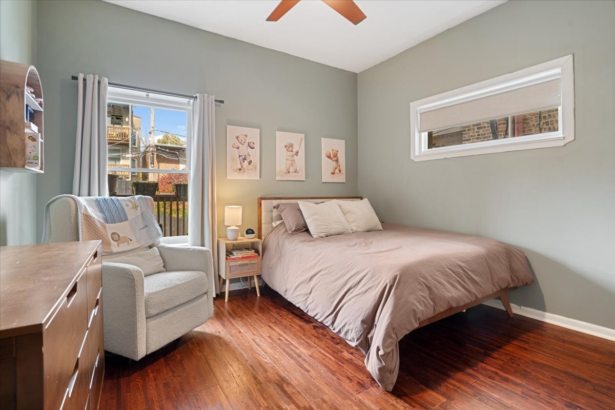 Undisclosed Address Chicago, IL 60613 - Photo 15 of 19 a bedroom with a bed and a couch