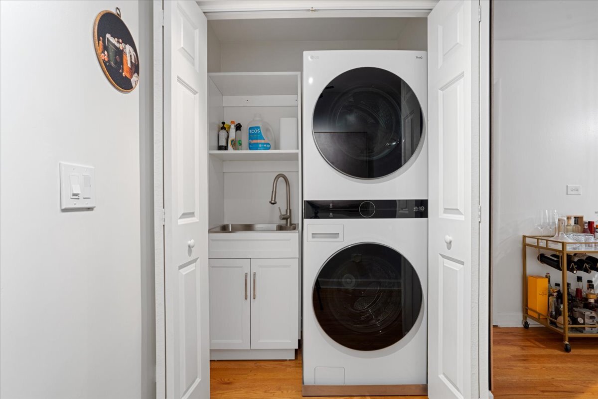 Undisclosed Address Chicago, IL 60613 - Photo 18 of 19 a view of a hallway with washer and dryer