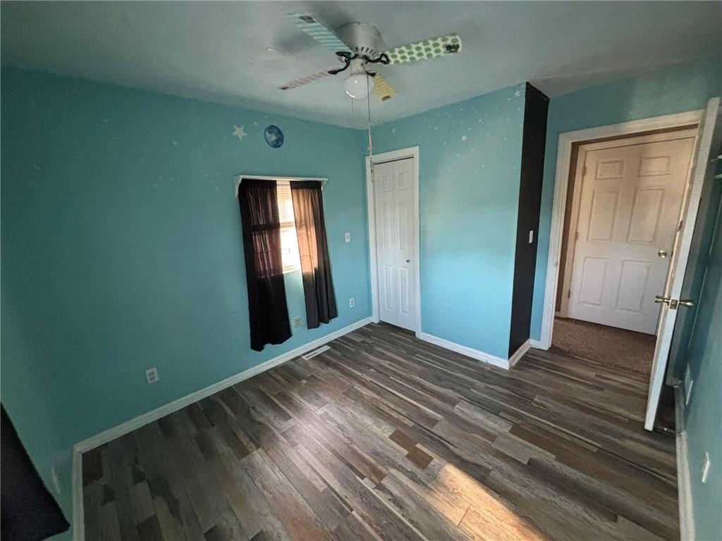 966 West Ridge Avenue Sharpsville, PA 16150 - Photo 12 of 17 a view of a room with wooden floor and windows